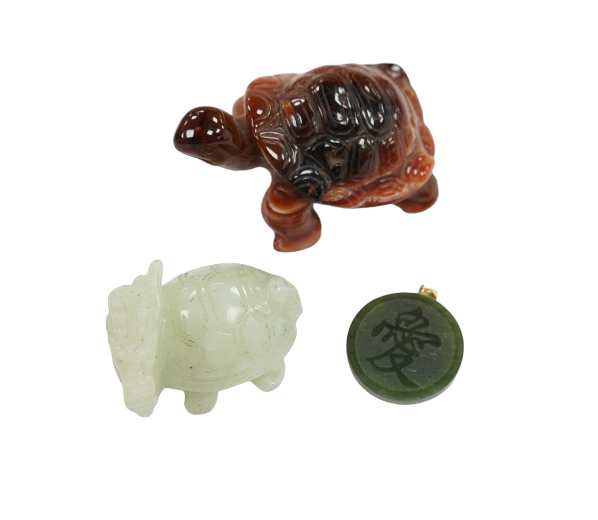 A Chinese carved bowenite dragon, an agate tortoise and a hardstone green circular pendant disc, largest 8cm long. Condition - good